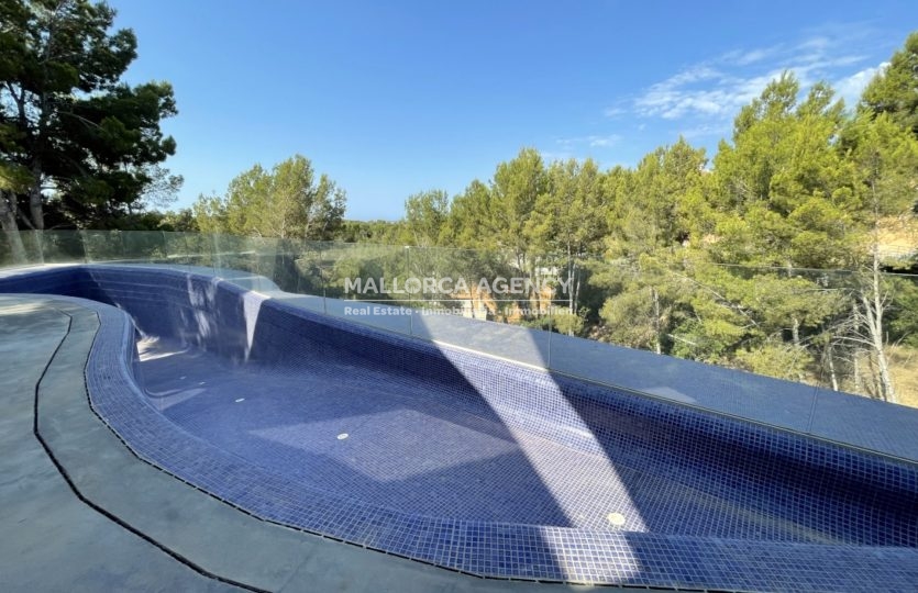 swimming pool with views of trees in Modern newly built Villa in Cas Catala for sale
