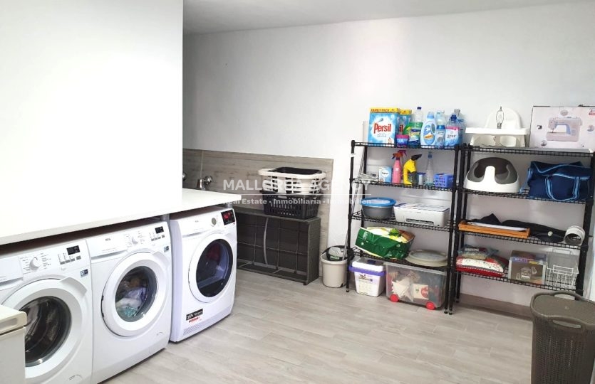 Laundry room in modern 6 bedroom home for sale in el toro